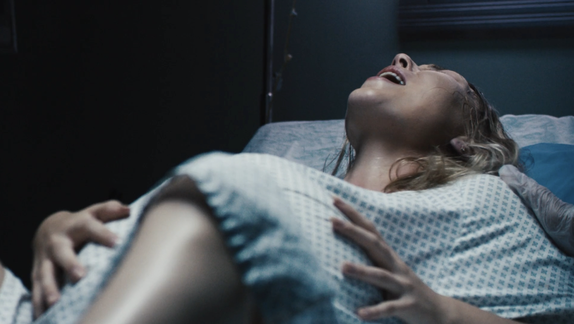 A woman in the throes of a staged labor
